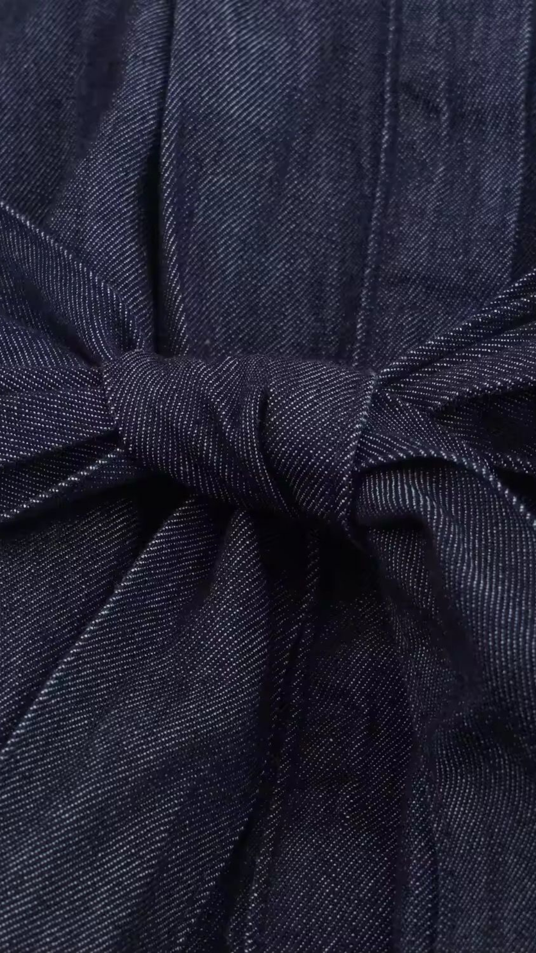 Navy blue fabric with a knot detail
