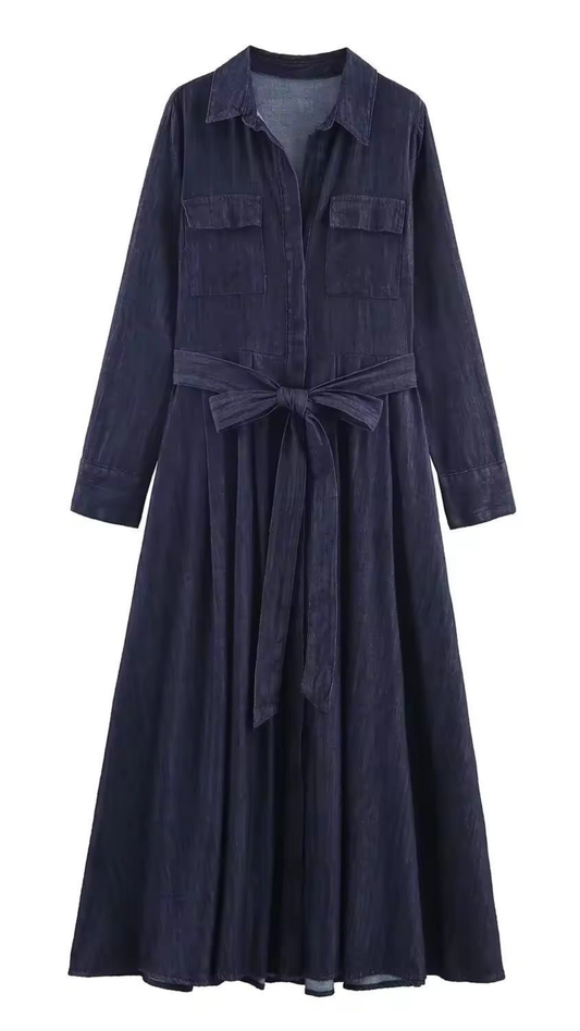 Navy blue dress with a belt on a white background