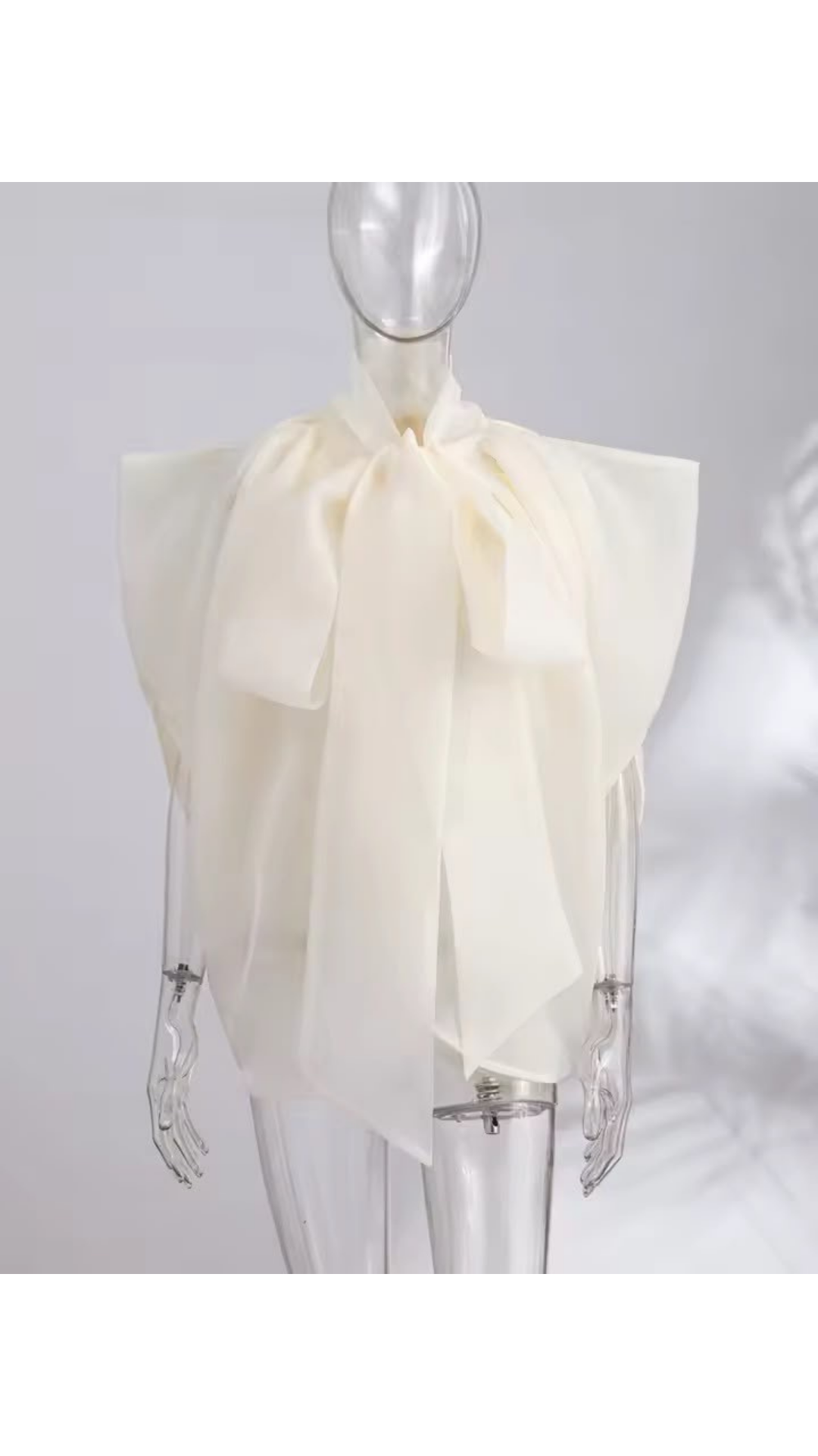 Cape bow blouse