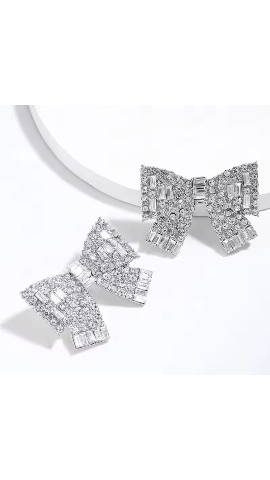 Bow embellished earrings
